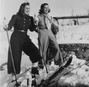 Young Women enjoying skiing together in the mountains. European Alps, 1935.