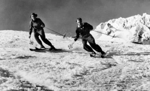 A black and white image of two skiers on Mt Hood near Timberline Lodge, Oregon. 